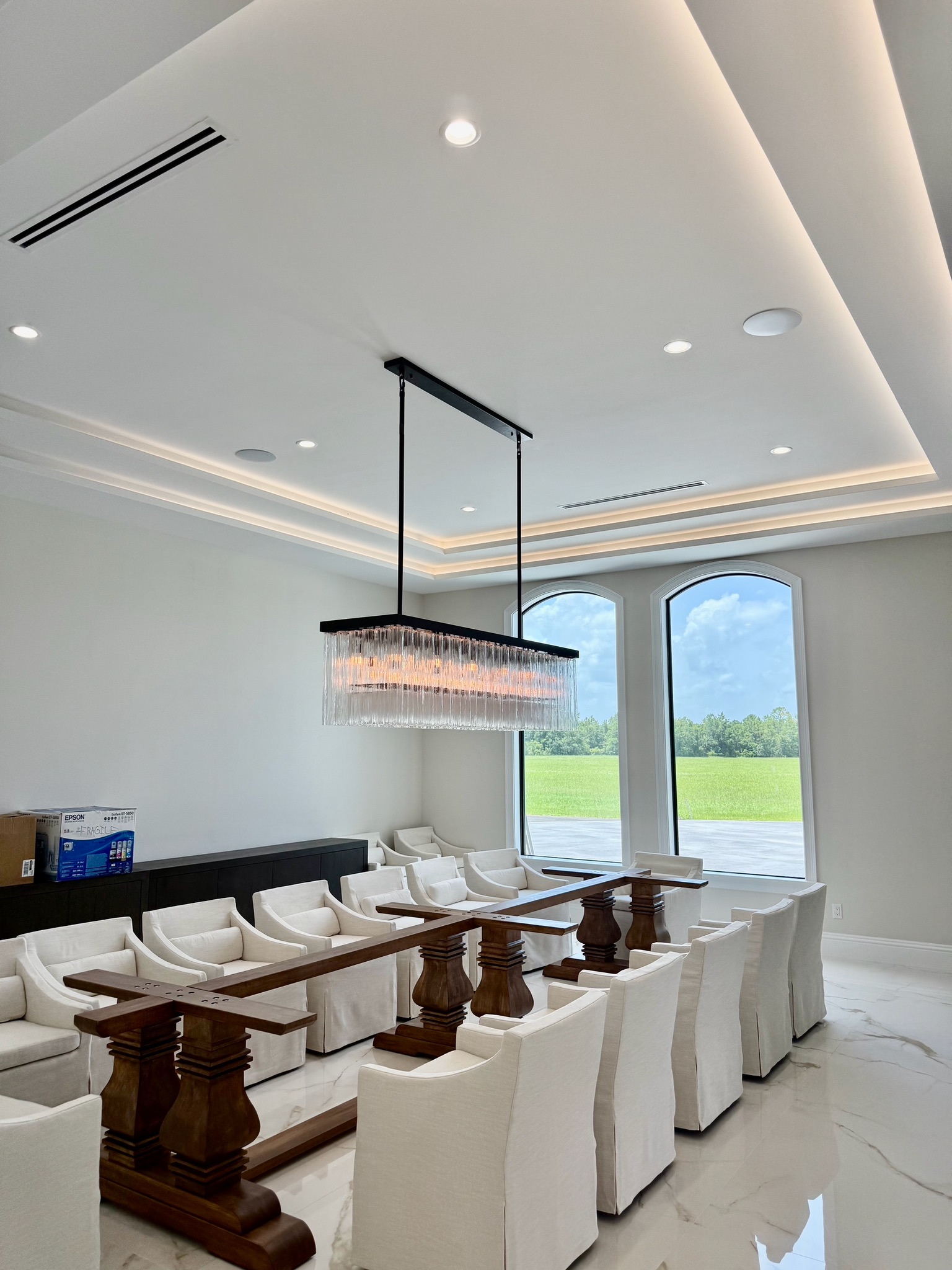 Beach Electric NSB Portfolio: New Construction Dining Room Recessed Ceiling Lighting, Ceiling Cove Lighting, and Chandelier